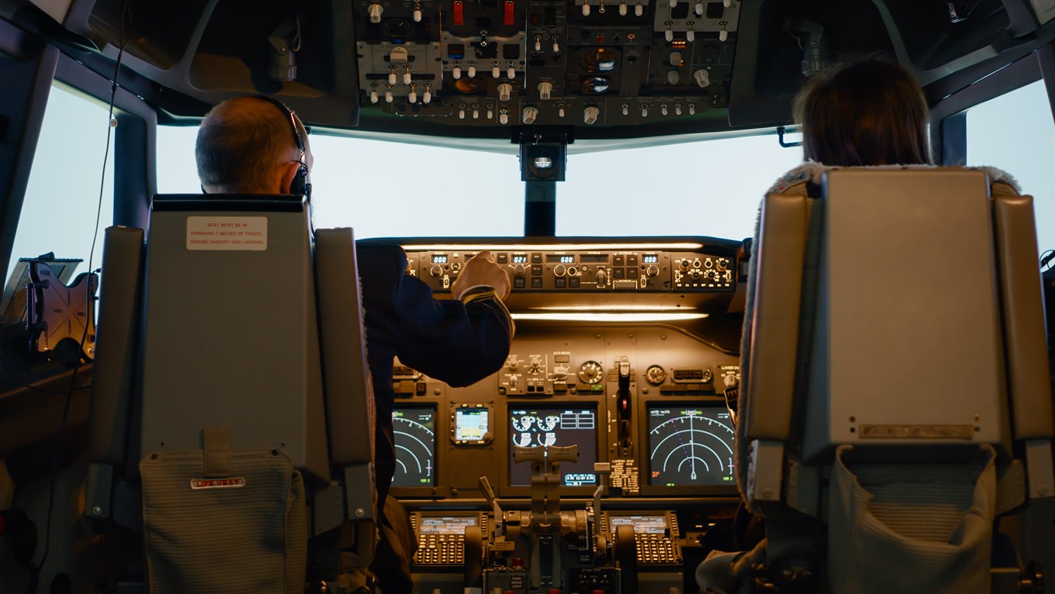 captain-woman-copilot-cockpit-preparing-fly-airplane-using-dashboard-command-buttons-fix-altitude-longitude-control-takeoff-aerial-navigation-with-radar-compass